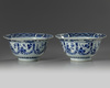 A pair of Chinese blue and white ‘floral’ klapmuts bowls