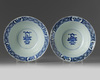 A pair of Chinese blue and white ‘floral’ klapmuts bowls