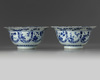 A pair of Chinese blue and white ‘floral’ klapmuts bowls