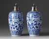 A pair of silver-mounted Chinese blue and white ovoid vases and covers
