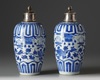 A pair of silver-mounted Chinese blue and white ovoid vases and covers