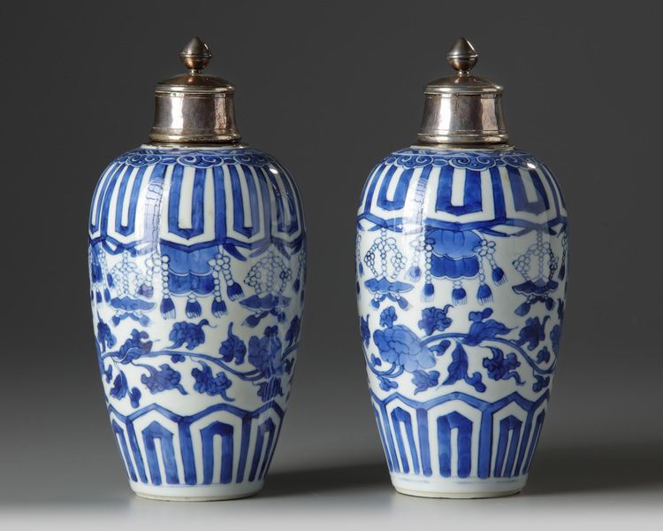 A pair of silver-mounted Chinese blue and white ovoid vases and covers