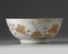 A Chinese iron-red and gilt-decorated moulded bowl