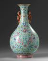 A Chinese turquoise-ground famille rose 'dragon and phoenix' vase
