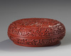 A CHINESE RED-LACQUERED 'PEONIES' BOX AND COVER, 19TH-20TH CENTURY