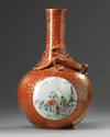 A Chinese iron-red-ground gilt-decorated famille rose bottle vase