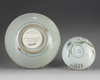 A Chinese Zhangzhou Swatow blue and white charger and a famille rose bowl