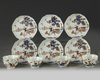 Six Chinese gilt and enamelled foliate cups and saucers