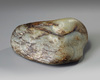 A Chinese celadon and russet jade jade 'goose' boulder