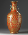 A Chinese coral-ground gilt-decorated slender vase