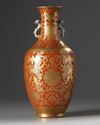 A Chinese coral-ground gilt-decorated slender vase