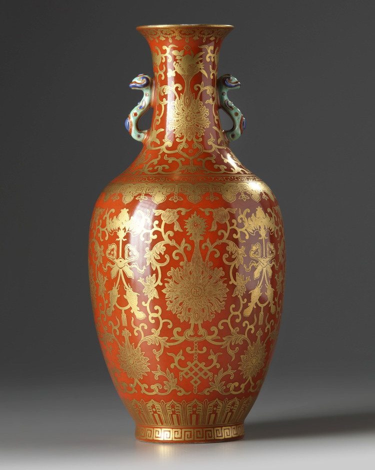 A Chinese coral-ground gilt-decorated slender vase