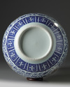 A Chinese blue and white and underglaze copper red-decorated ‘flower scroll’ bottle vase