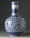 A Chinese blue and white and underglaze copper red-decorated ‘flower scroll’ bottle vase