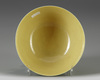 A Chinese yellow-ground green-enamelled 'Eight Buddhist Emblems' bowl