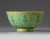 A Chinese yellow-ground green-enamelled 'Eight Buddhist Emblems' bowl