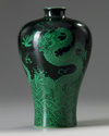 A Chinese black-ground green-enamelled 'twin dragon' meiping