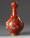 A Chinese coral-ground famille rose 'bird and flowers' garlic-head vase
