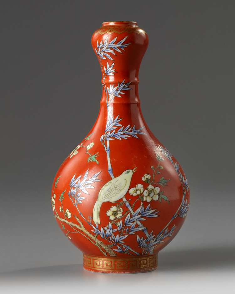 A Chinese coral-ground famille rose 'bird and flowers' garlic-head vase