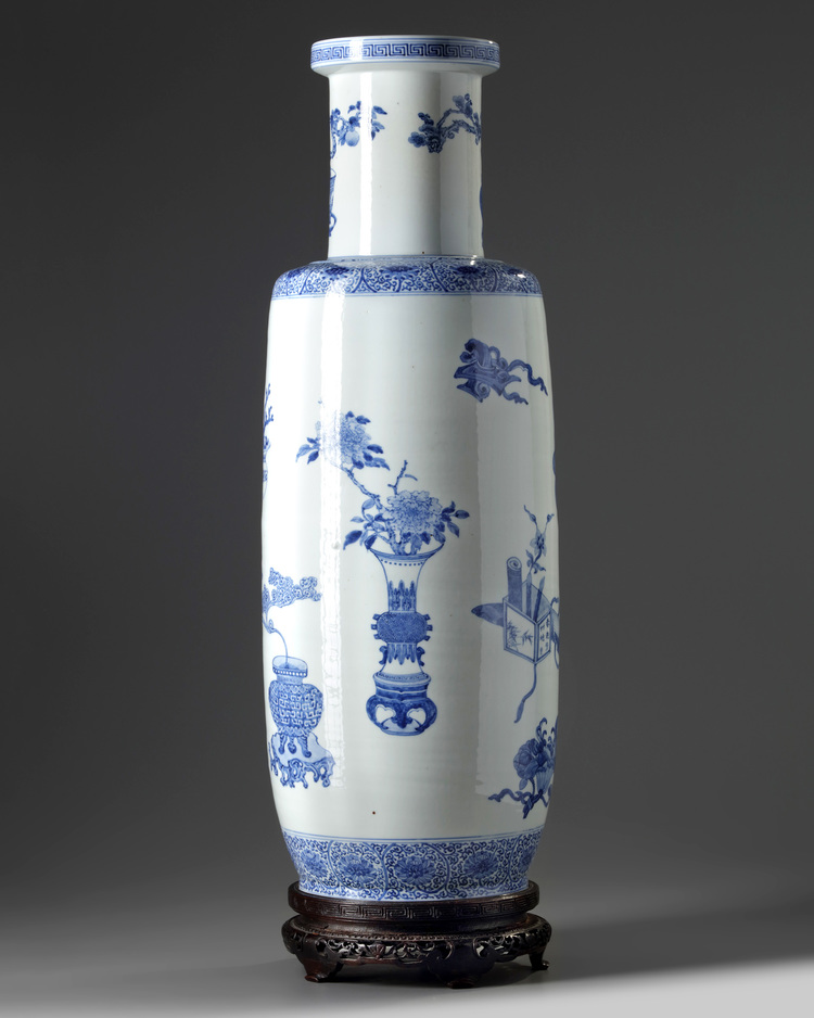 A large Chinese blue and white 'precious objects' rouleau vase