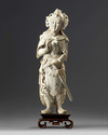 A large Chinese carved ivory figure of a guardian