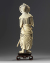 A large Chinese carved ivory figure of a guardian