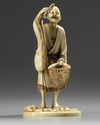 An ivory Japanese figure of a fisherman