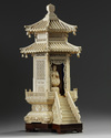 A carved ivory monk in a large ivory shrine. The Shrine is Chinese, the monk Japanese.