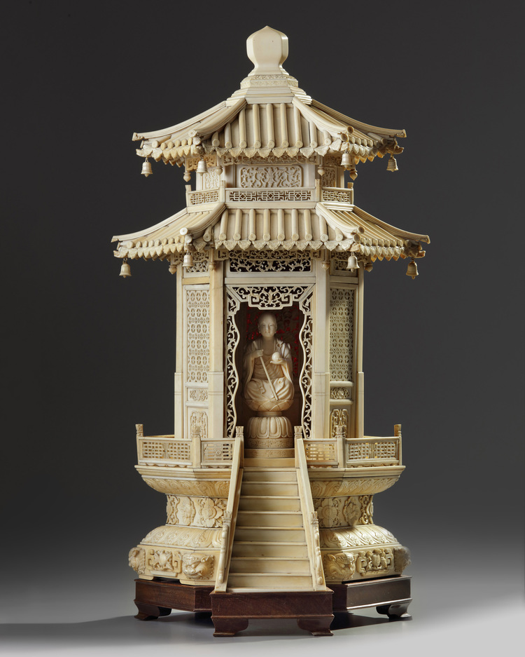 A carved ivory monk in a large ivory shrine. The Shrine is Chinese, the monk Japanese.