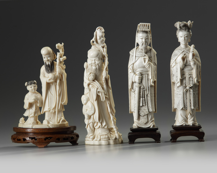 A group of four Chinese ivory figural carvings