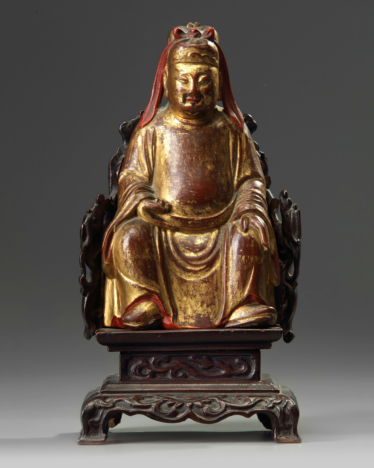 A Chinese gilt-lacquered wood figure of Wen Chang on a wooden throne