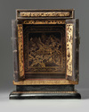 A Chinese gilt-lacquered carved wood altar cabinet