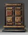 A Chinese gilt-lacquered carved wood altar cabinet