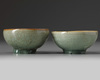 A pair of small Chinese Longquan celadon crackle-glazed bowls