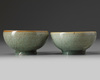 A pair of small Chinese Longquan celadon crackle-glazed bowls