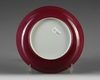 A small Chinese ruby-back famille rose 'bird and flower' dish