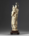 A large Chinese ivory carving of a lady holding a parasol