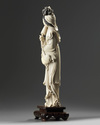 A large Chinese ivory carving of a lady holding a parasol