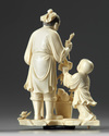 A Chinese carved ivory 'boy and scholar' group