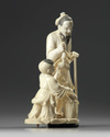 A Chinese carved ivory 'boy and scholar' group