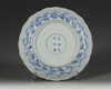 A Chinese blue and white 'Eight Daoist Emblems' barbed rim dish