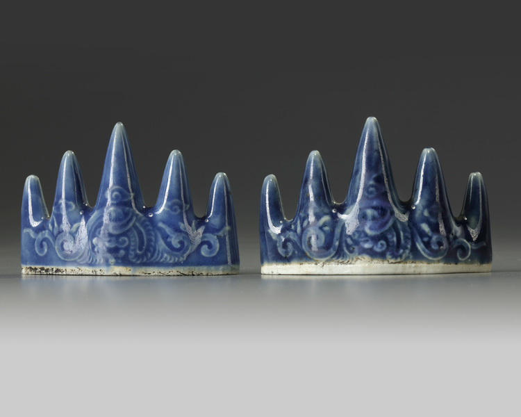 A pair of Chinese blue glazed 'mountain' brush rests