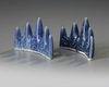 A pair of Chinese blue glazed 'mountain' brush rests