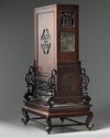 A Chinese gilt bronze clock in a hongmu case and stand