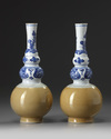 A pair of Chinese café-au-lait-glazed blue and white triple gourd vases
