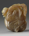 A Chinese celadon and russet jade 'boy and goose' carving