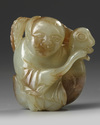 A Chinese celadon and russet jade 'boy and goose' carving
