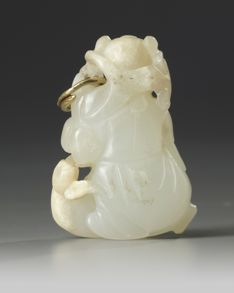 A Chinese pale celadon jade 'boy and crane' carving