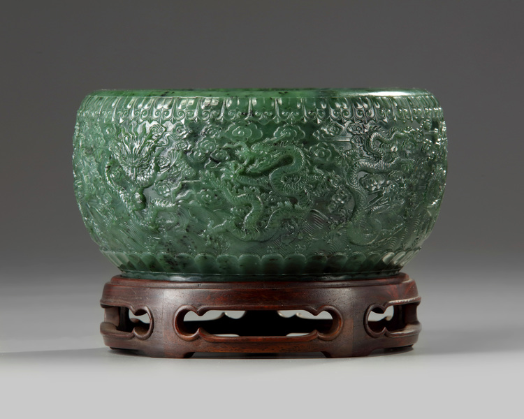 A Chinese spinach green jade 'nine dragons' bowl