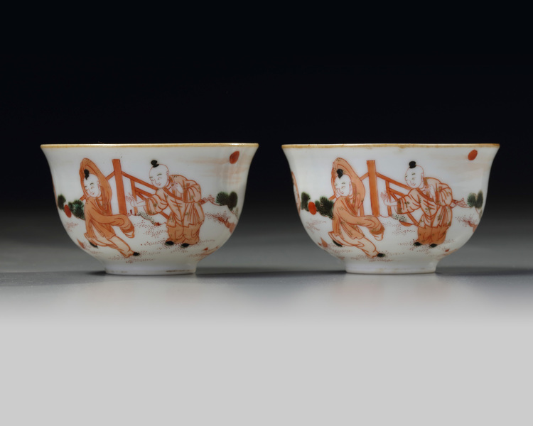 A PAIR OF CHINESE IRON-RED DECORATED 'BOYS' CUPS